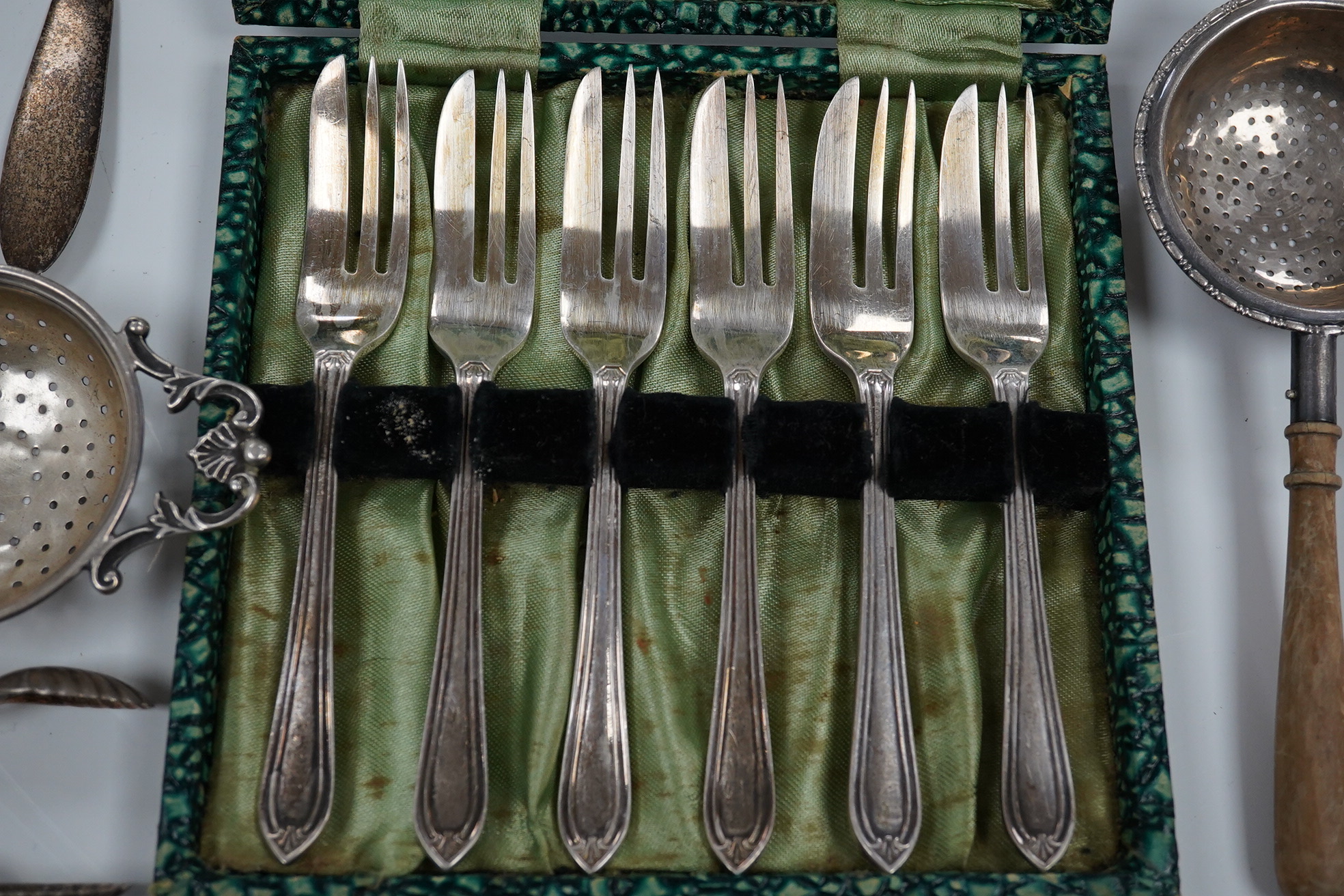 Sundry silver including cake forks, sifter ladle, salt spoons, Victorian silver handled bread knife, etc. Condition - poor to fair